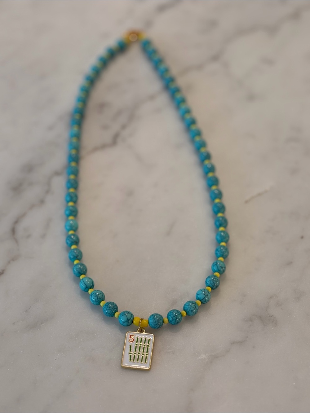 Turquoise Beaded Necklace with Gold Mahjong Bam Charm